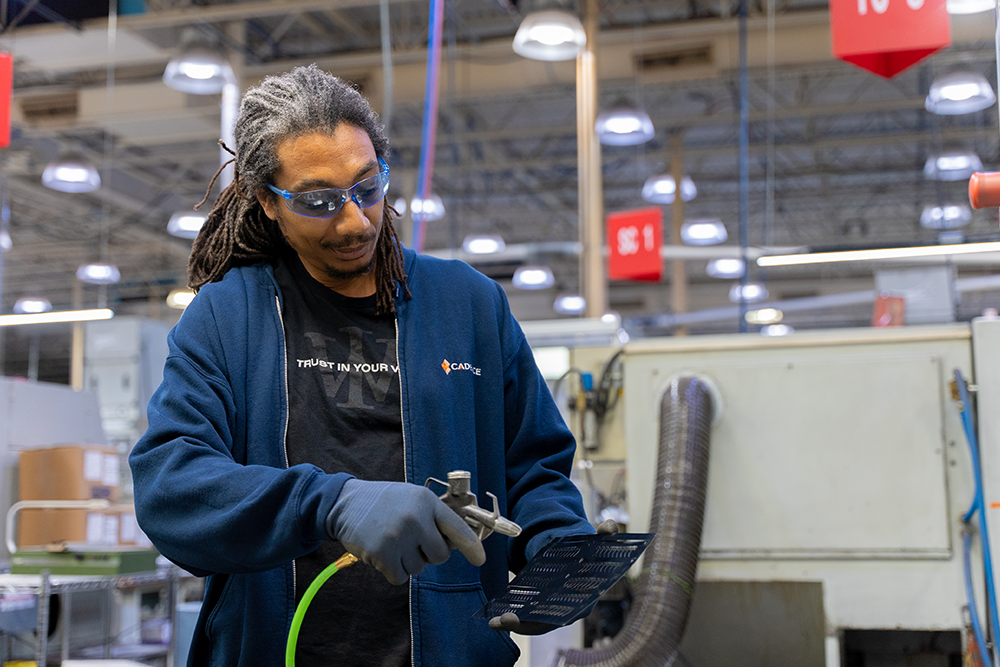 Male manufacturing products in a factory