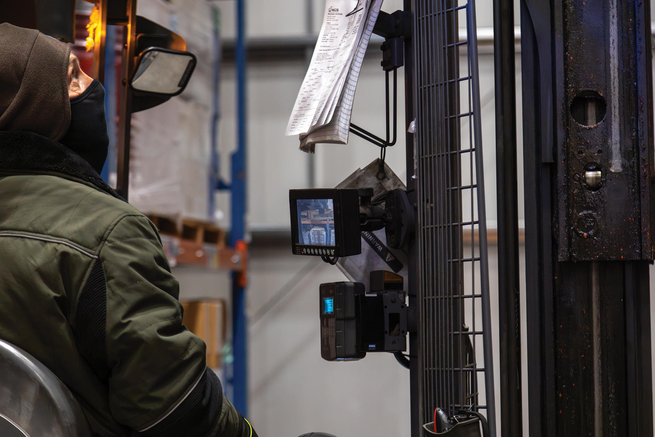 Photo of a WCS Logistics Employee operating machinery