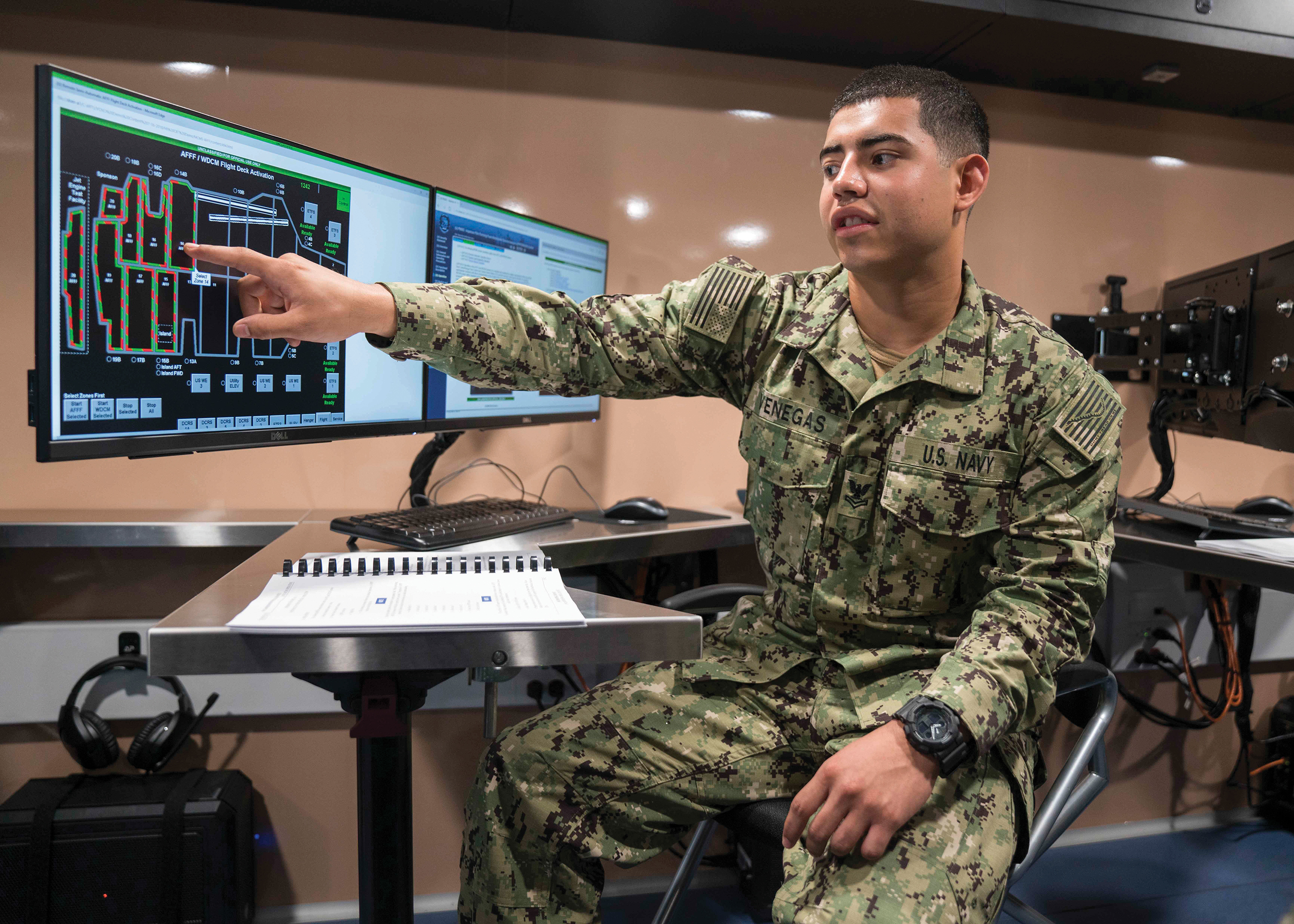 Veteran in uniform working on the computer 