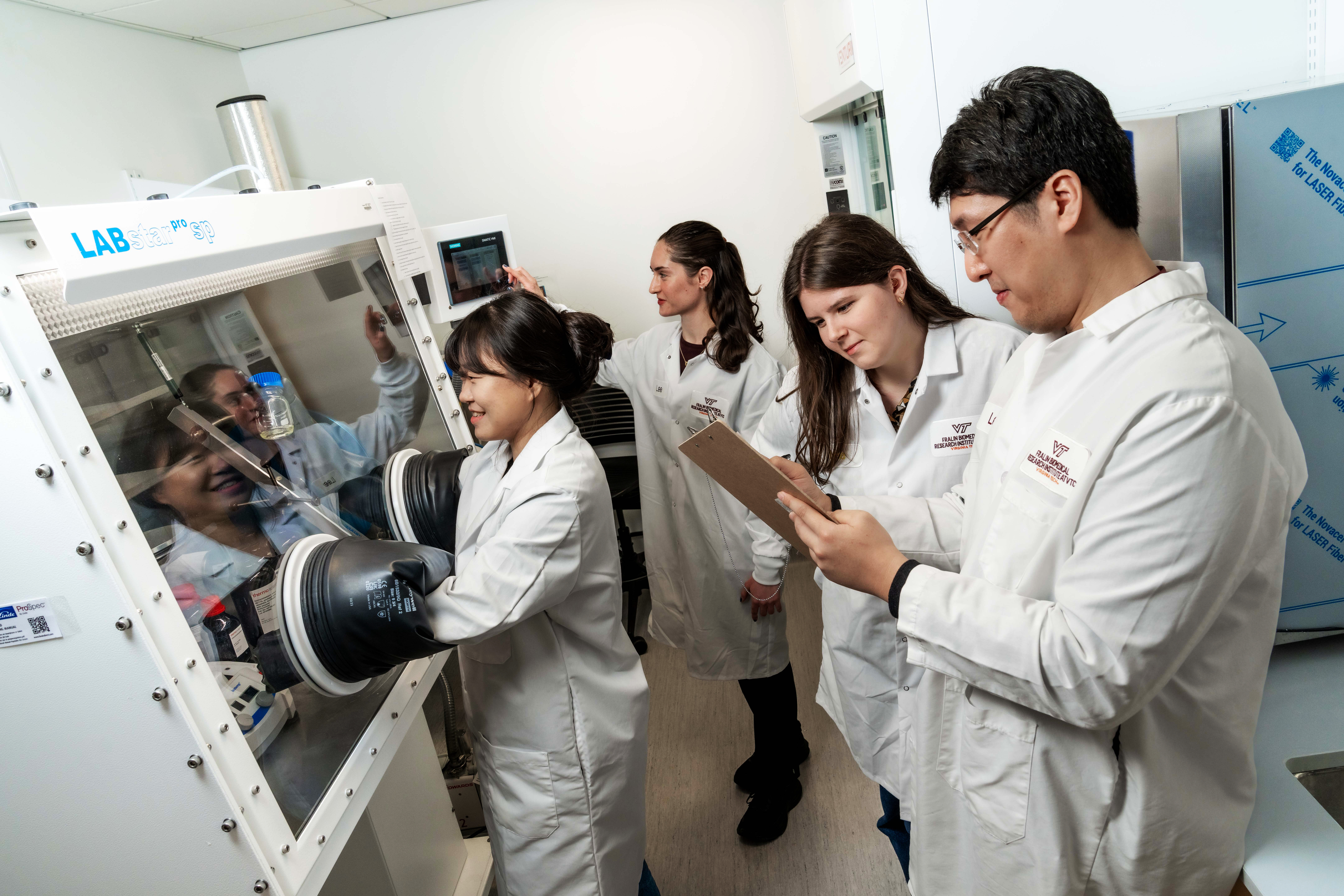 Four scientists in a lab.