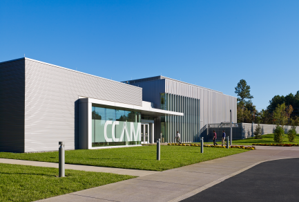 The exterior of a building with a sign on the front that says CCAM