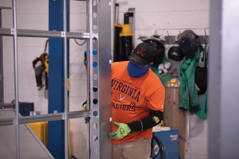 An employee a Modine Manufacturing works on the facility floor