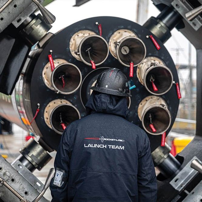 Rocket Lab Employee inspects a rocket at their Wallops Island facility