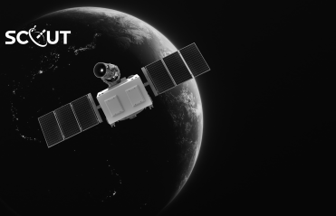 Black and white photo of a satellite in space