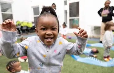Child playing on playground during daycare