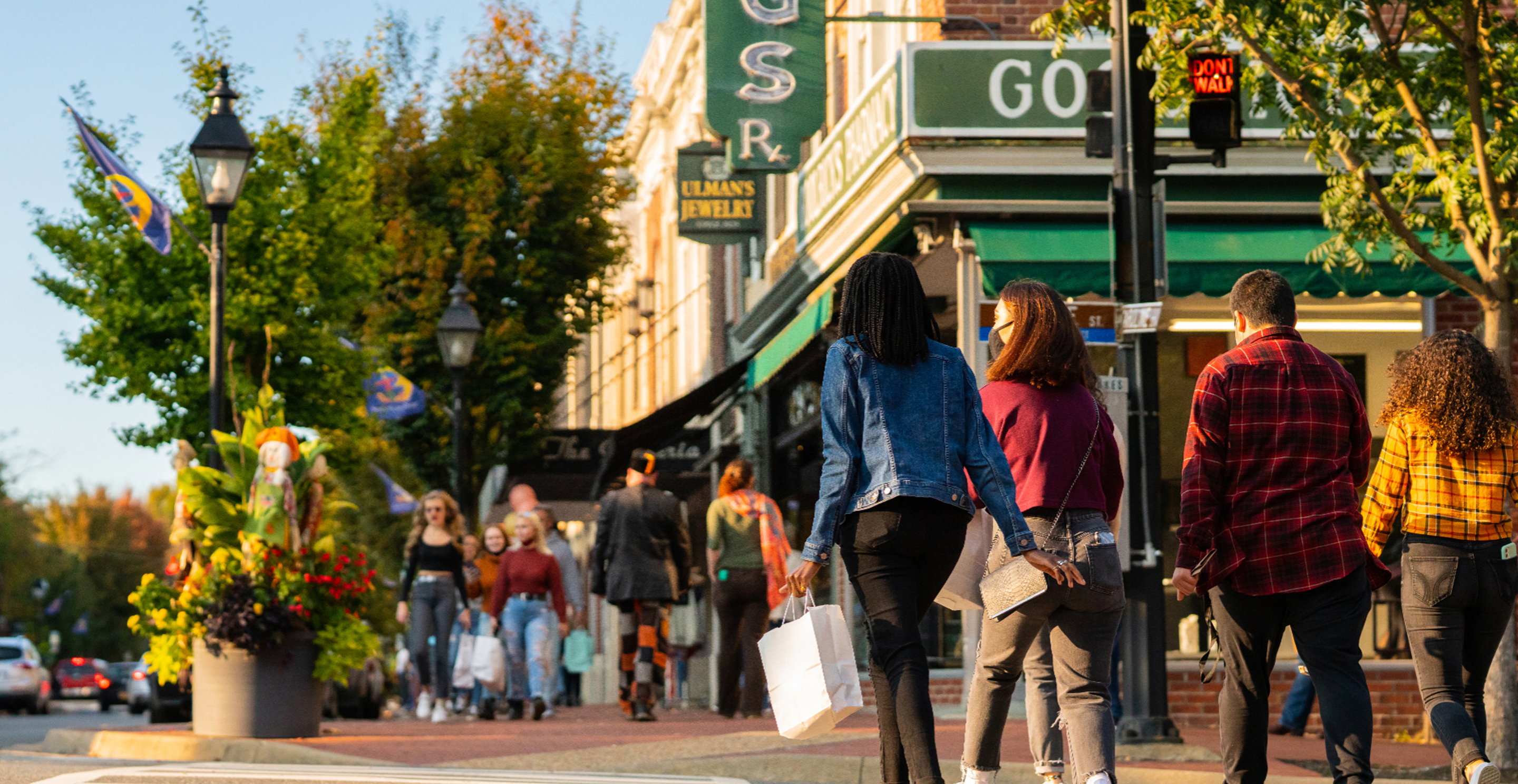 People walking and shopping along a downtown street