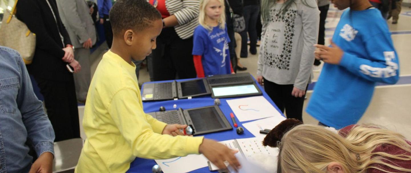 Elementary school students in South Boston use robots to learn coding principles
