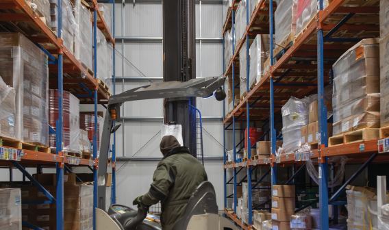 Person operating machine at WCS Logistics facility