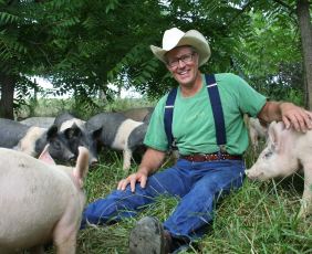 Joel Salatin with pigs