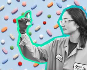 Merck scientist looking a vile. 